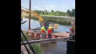 Excavator Falls Into Water During Construction Mishap in Florida [upl. by Chubb547]