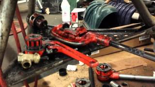 Using a Ridgid 300 tripod pipe threader [upl. by Ahsyekat567]