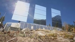 Giant mirrors reflect sunshine into dark Norway town of Rjukan [upl. by Eenot639]