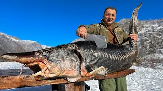 A Giant Sturgeon Roasted Under A Barrel In A Bonfire Dinner In A Snowy Village [upl. by Ahsitniuq]