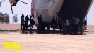 Authorities begin deporting planes full of migrants from Texas l GMA [upl. by Anabella]