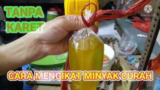 cara mengikat minyak curah menggunakan tali rafia tanpa karet minyak minyakgoreng binding oil [upl. by Griselda614]