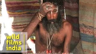 Aghori sadhu with skull applying human ash [upl. by Ynetsed]