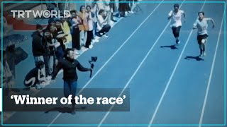 Cameraman outruns sprinters at university race in China [upl. by Nnazil]