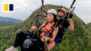 Paragliding offers birds eye view of Hong Kong [upl. by Witty]