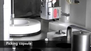 AseptiBot dispensing I131 solution into gel capsules [upl. by Sarette]