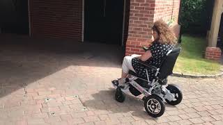 Going up half curbs in an electric folding wheelchair  SMART CHAIR 2 CUSTOMER DEMO [upl. by Coleen]