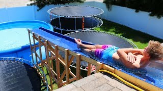 GIANT Backyard Water Slide in our Trampoline Water Park [upl. by Bahr]