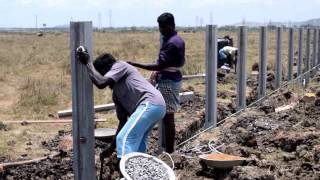 Erecting a concrete fencing posts [upl. by Phaedra]