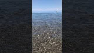 🌊 Walking on the clear beach on IssykKul lake in Kyrgyzstan 🇰🇬 IssykKul lake in Kyrgyzstan travel [upl. by Pascasia]