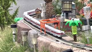 TYCO Streamliner cars klickety klack￼ around the garden railroad at high speeds with Athearn SP F7 [upl. by Nylessej]