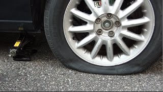 How To Change A Flat Tire Like A Boss [upl. by Schwinn511]