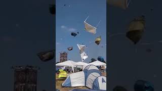 Vortex sends festival tents flying majestically through the air [upl. by Beare]