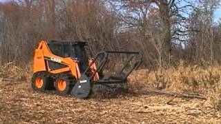 Loftness Timber Ax Hydraulic SkidSteer Mounted Brush Cutter and shredder [upl. by Eiggam]