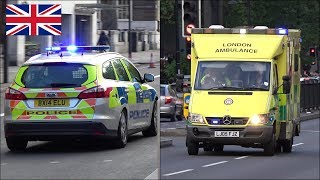 Police cars and ambulances responding with siren and lights in London [upl. by Iaria]