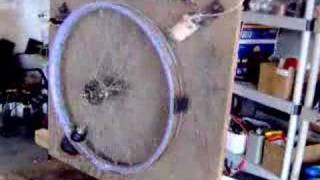 Pendulum on Bicycle Wheel Swung by Impulse Coil [upl. by Michigan]