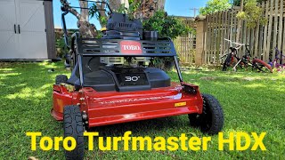 Toro Turfmaster HDX cutting thick wet overgrown grass Stihl KMA131R string trimmer [upl. by Isac]