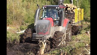 New Valtra T144 with large trailer Kronos 160 4WDM and Gripto 1010 loader logging in wet forest [upl. by Nej]