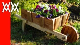 Make a rustic wheelbarrow garden planter Easy DIY weekend project [upl. by Hcaz]