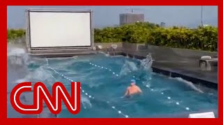 Video shows what happened when a man was swimming during the massive earthquake [upl. by Hanafee]