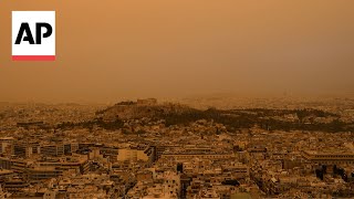 Athens Greece skies turn orange with dust clouds from North Africa [upl. by Adnwahsat]