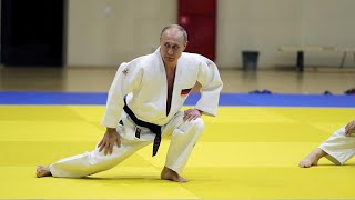 Black belt Putin shows off judo moves with Olympic athletes [upl. by Loredo905]