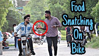 Food Snatching On Bike  Pranks In Pakistan  Desi Pranks 20 [upl. by Hobard219]