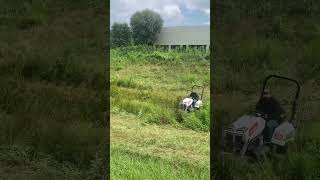 Bobcat AT450 in action with a 72” brush cutter mowing a retention pond power mower subscribe [upl. by Auqinahs]