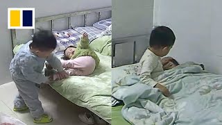 Boy puts little sister to sleep while mother is at work [upl. by Anaibaf]