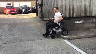 How to go down a full curb in an electric folding wheelchair  LITHTECH SMART CHAIR X [upl. by Ayaladnot]