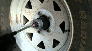 How to Grease Trailer Wheel Bearings with EZ Lube Grease Cert [upl. by Rowell]