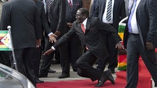 WATCH Robert Mugabe falls down steps in Harare [upl. by Tiebold918]