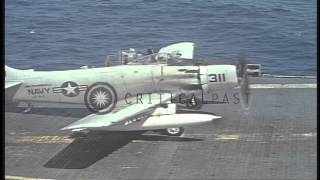 US Navy A1H Skyraiders and a C1A land on USS Ticonderoga in the Gulf of Tonkin HD Stock Footage [upl. by Shuler956]