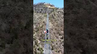 New ‘Tibetan’style bridge lets thrillseekers walk over 500 feet above the ground [upl. by Leola]