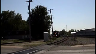 Rare CNIC local on exCampO at Griffith Indiana meets container train [upl. by Jed145]