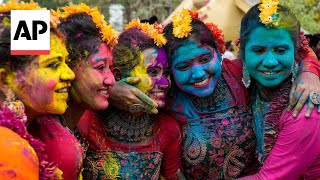 Holi festival celebrated with bursts of color across India [upl. by Nalliuq]