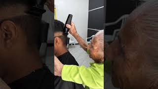 old woman cuts man hairs with scissors [upl. by Espy]