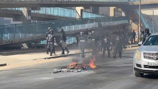 Protesters build barricades in Dakar as clashes follow Senegal election postponement  AFP [upl. by Romano]