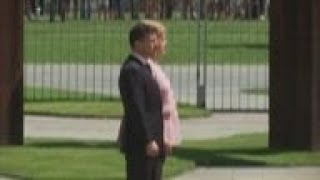 Germany  Merkel visibly shaking during ceremony [upl. by Procto539]