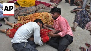 More than 100 dead in stampede at religious gathering in northern India officials say [upl. by Gawlas16]