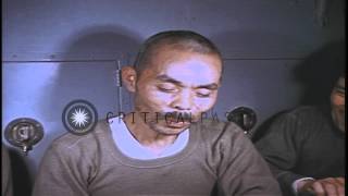 Japanese prisoners seated at a table eating food aboard USS Skate underway in theHD Stock Footage [upl. by Sharia109]