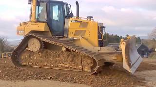 CAT D6 dozer at work pushing gravel for road construction part 1 [upl. by Silvanus]