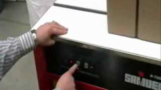 How to use a Strapping Machine  PTIPackagingcom [upl. by Karmen378]