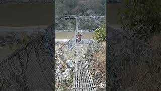 Suspension bridge crossing on pulsar150 nepalisongNepal [upl. by Krauss]