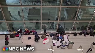 Migrants shelter inside Bostons Logan International Airport [upl. by Nett]