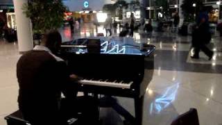 Traveler playing piano at Charlotte Airport [upl. by Eilujna]