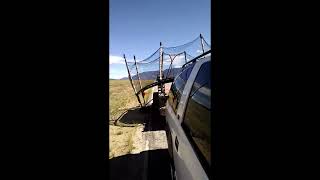 Moving a Trampoline on a trailer without disassembling  redneck all the way [upl. by Narahs]