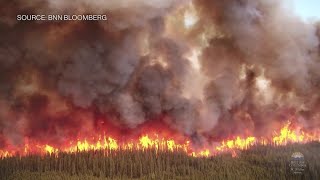 Raging Wildfires Burn Across Canada Sending Smoke Down to the US [upl. by Alihs]