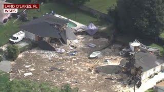 Sinkhole swallows homes in Florida neighborhood [upl. by Annadroj]