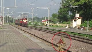 Crazy Woman trying to cross tracks infront of speeding train 11015 Kushinagar Express [upl. by Llyrad]